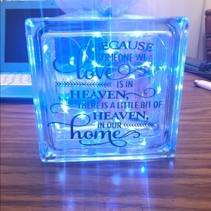 Clear glass box with lights and ribbon